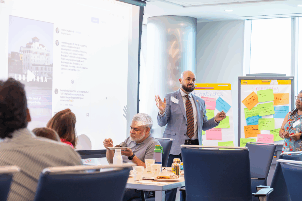 Mayor Ellis shares an update at the Champions Alumni Convening. 